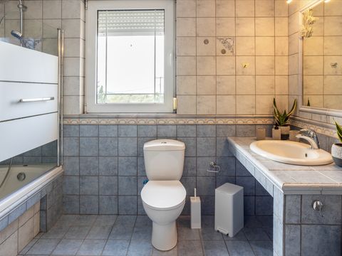 Bathroom with bathtub and shower